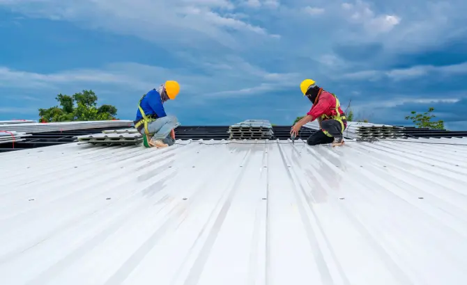 Commercial metal roof replacement in progress in Miami