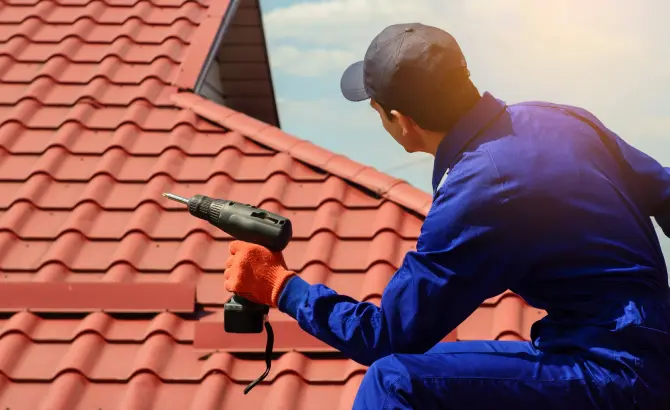 Professional roofing crew installing luxury tile roof in Miami